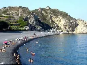 Mavra Volia beach in Chios with iconic black volcanic pebbles