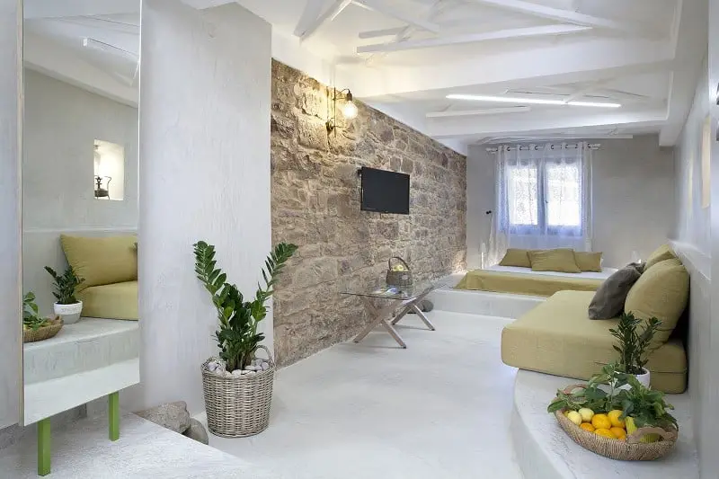 Standard room with traditional stone wall in Chios